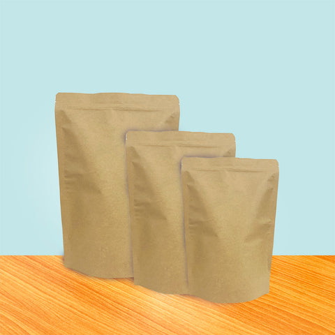 Premium Photo | A row of blank craft paper bag packaging with soft cookies  inside mockup template kraft paper zipper pouch packaging for bakery snacks  on wooden shelf